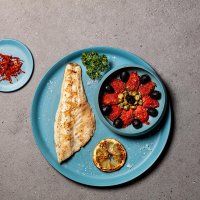 Fillet of sea bass with tomatoes, olives and capers