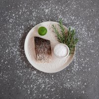 Fillet of ombrina with lime, rosemary and decorative bowl with salt