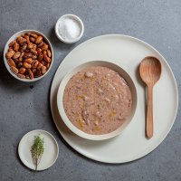 Bean soup with salt bowl, bean bowl and wooden spoon